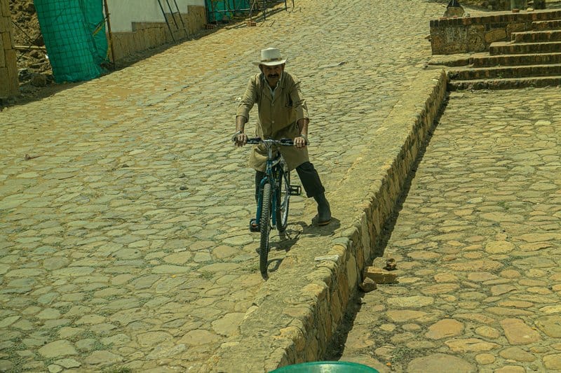 People walking in Villa de Leiva, Colombia at dusk