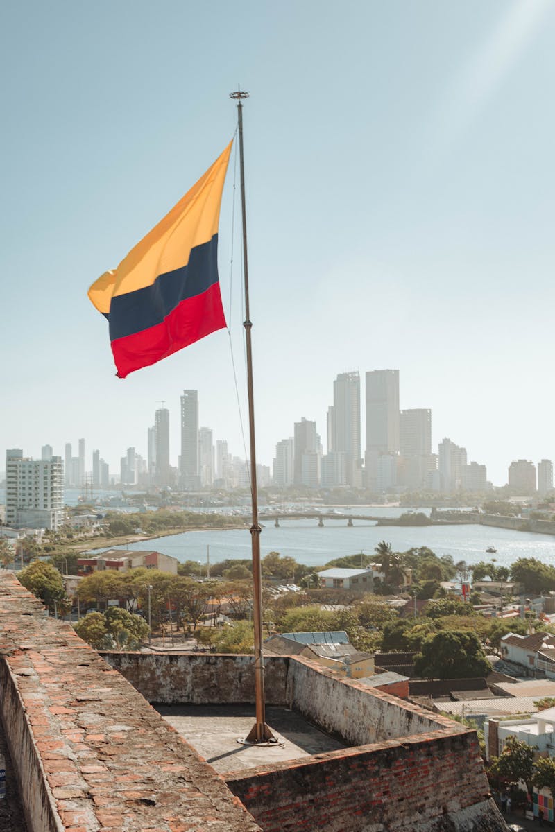 Colombian flag flying above the Cartagena skyline and Bocagrande peninsula