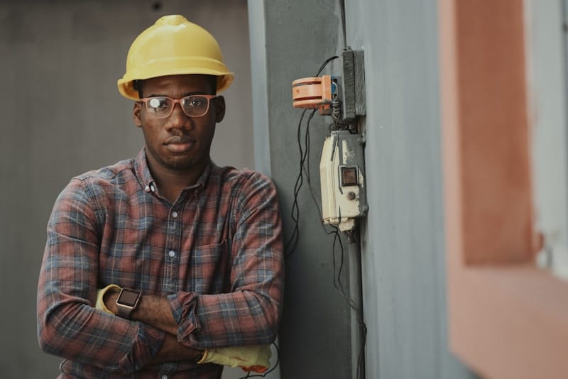 Home service worker in hard hat and work gloves in Colombia