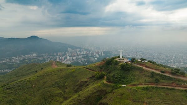 Cristo Rey statue overlooking Cali, Colombia with dramatic cloudscape