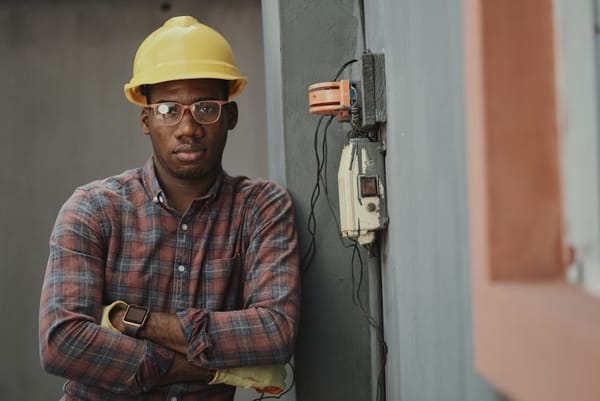 Home service worker in hard hat and work gloves in Colombia