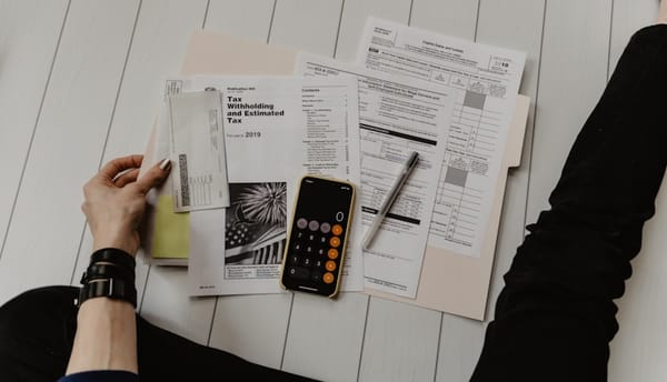Business professionals reviewing an employment contract in a Colombian office