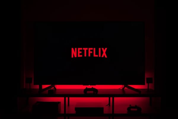 Netflix logo on TV screen with red ambient lighting